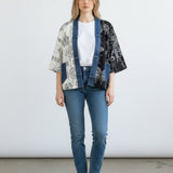 Broderick's Clothing Co. Karol Cardigan with split-panel black and cream floral print and denim trim details.