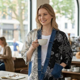 Broderick's Clothing Co. Shannon Passero Karol Cardigan with split-panel floral print and denim trim in a cafe setting