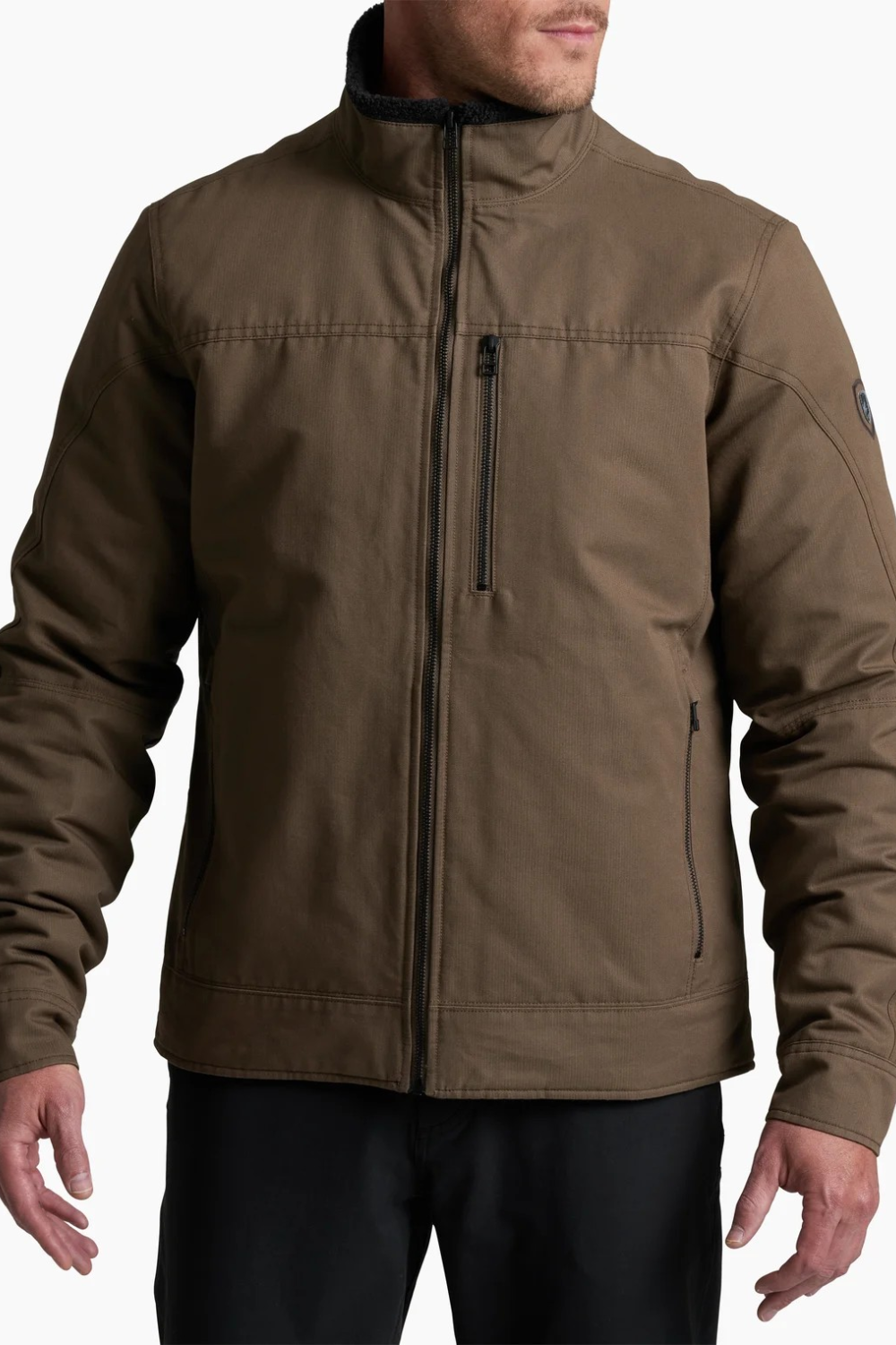 Broderick's Clothing Co. KÜHL BURR insulated jacket in brown cotton with a zip-up front and berber collar detail.
