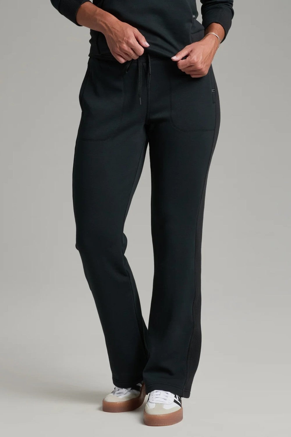 Broderick's Clothing Co. KÜHL Kozy black fleece-backed knit pants with a pull-on waistband and rib paneling details.