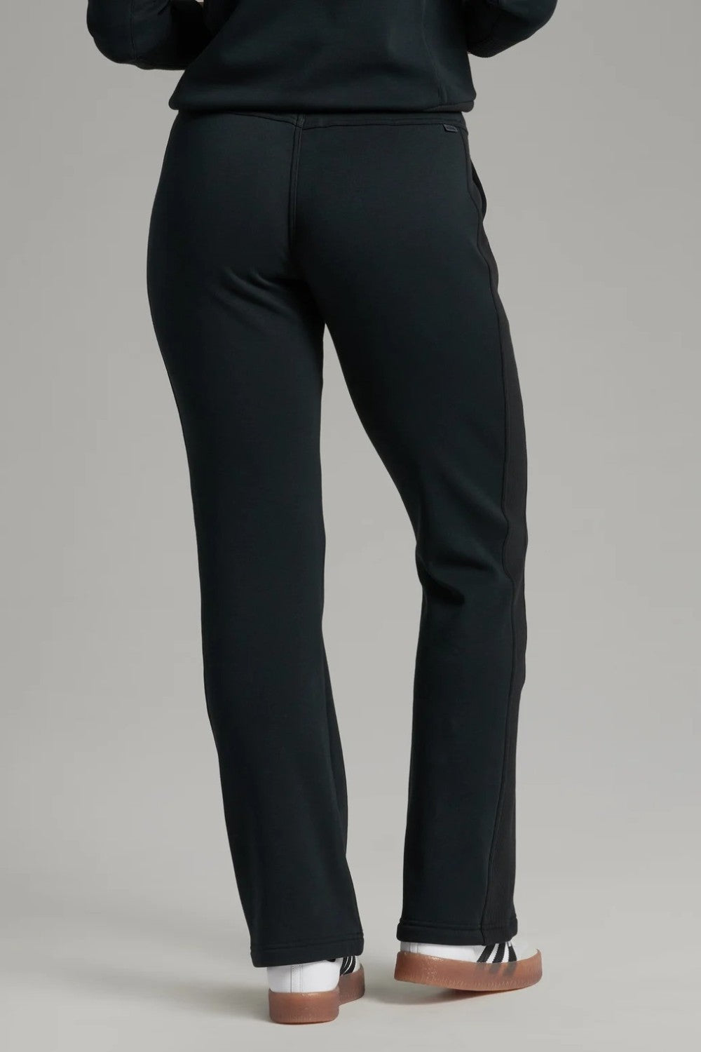 Back view of Broderick's Clothing Co. KÜHL Kozy black fleece-backed knit pants with a comfortable pull-on waistband.