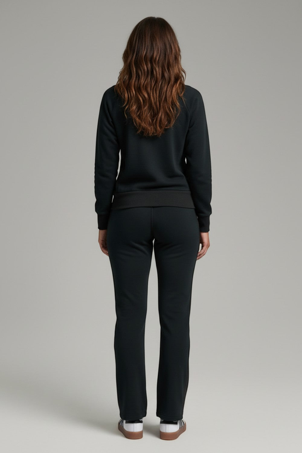 Broderick's Clothing Co. KÜHL Kozy black fleece-backed knit pants worn by a woman from a rear view