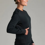 Broderick's Clothing Co. KÜHL Kozy black crewneck sweatshirt with rib paneling and side pockets on a female model