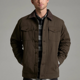 Broderick's Clothing Co. KÜHL MAVERICK brown canvas jacket with fleece lining worn by a man on a grey background