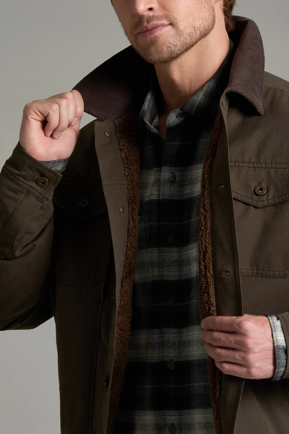 Broderick's Clothing Co. KÜHL MAVERICK jacket in brown canvas with a warm fleece lining and corduroy collar detail.