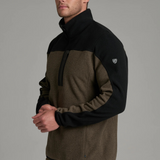 Broderick's Clothing Co. KÜHL SKORCHR fleece 1/4 zip sweater in olive and black worn by a man against a grey background