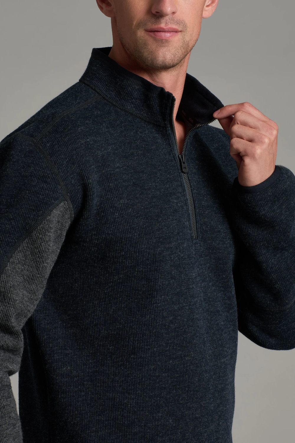 Broderick's Clothing Co. KÜHL Thor 1/4 zip sweater in dark navy wool blend with microfleece interior and grey panels.