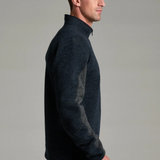 Broderick's Clothing Co. KÜHL Thor 1/4 zip sweater in dark navy wool blend with grey underarm gussets on a model