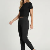 Broderick's Clothing Co. KÜHL Vantage black lined jogger pants with elastic waistband worn by a woman