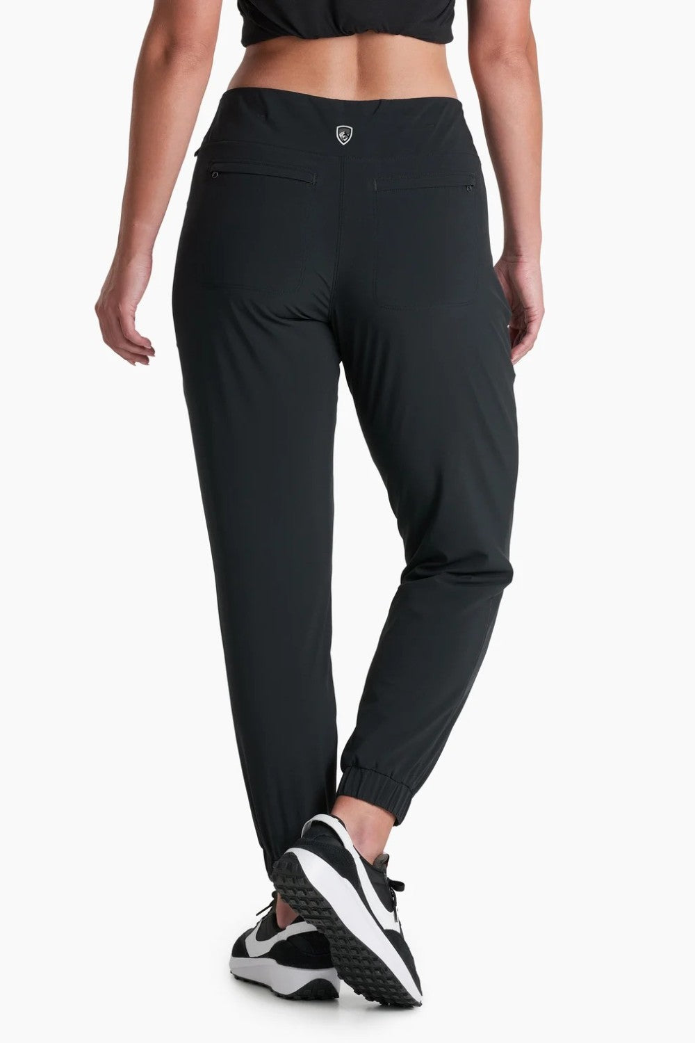 Broderick's Clothing Co. KÜHL Vantage black lined jogger pants with elastic cuffs, back view on a model.