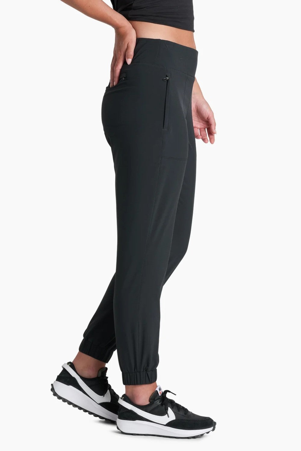 Broderick's Clothing Co. KÜHL Vantage black lined jogger pants with elastic cuffs and waistband on a model