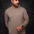 Broderick's Clothing Co. Au Noir LACAUNE beige cashmere crew neck sweater worn by a man against a damask background