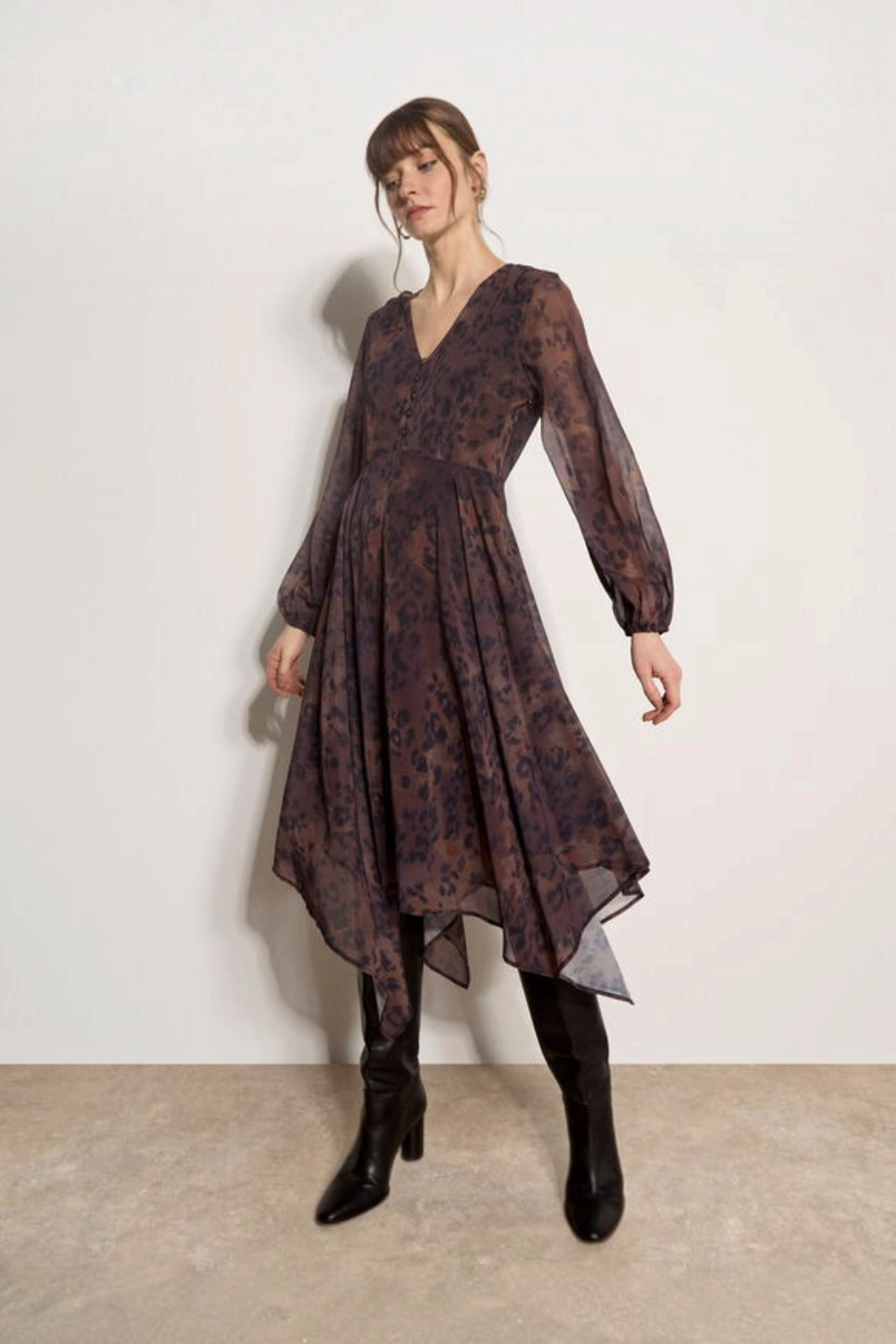 Broderick's Clothing Co. apricot and brown leopard print chiffon midi dress with hanky hem and blouson sleeves.