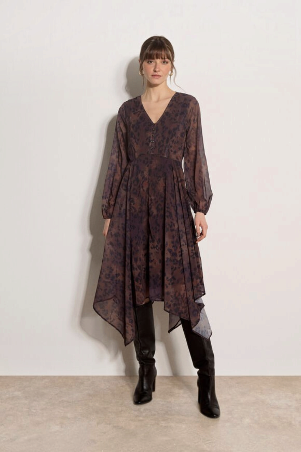 Broderick's Clothing Co. apricot leopard print chiffon midi dress with V-neck, blouson sleeves, and hanky hem.