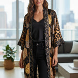 Broderick's Clothing Co. Shannon Passero Dylan kimono cardigan with black, gold, and leopard print circular motifs.