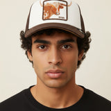 Broderick's Clothing Co. Goorin Bros. brown and white trucker hat with longhorn patch worn by a man