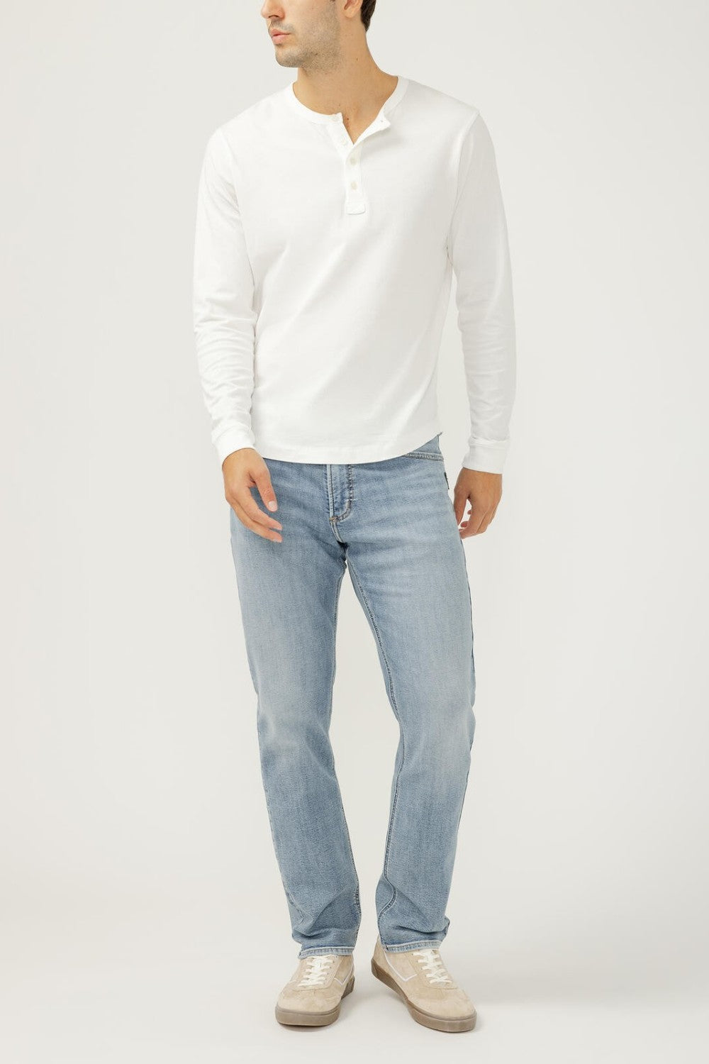 Broderick's Clothing Co. Silver Jeans Co. Machray light wash slim straight fit denim jeans worn by a male model