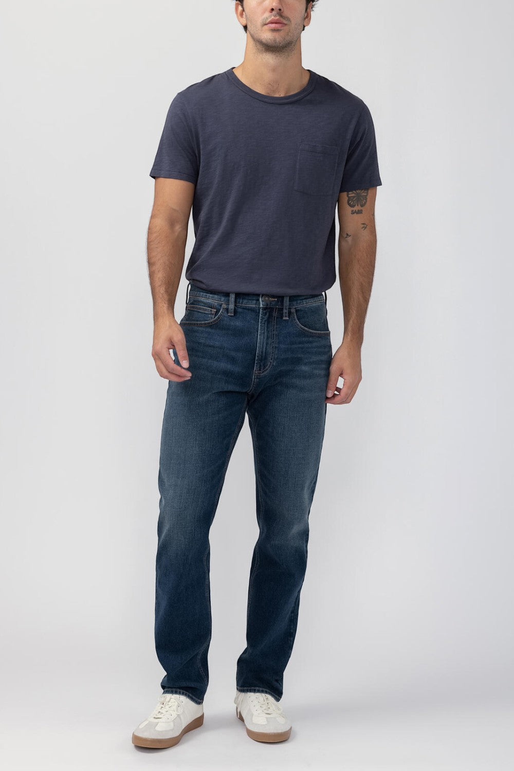 Broderick's Clothing Co. Silver Jeans Co. Machray straight leg jeans in medium wash denim worn by a male model