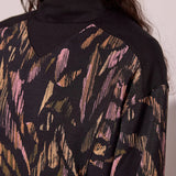 Broderick's Clothing Co. black modal mock neck top with pink and tan abstract print and ribbed shoulder detail