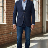 Broderick's Clothing Co. 7 Downie St. navy denim knit sport coat worn by a man with a light blue shirt and jeans.