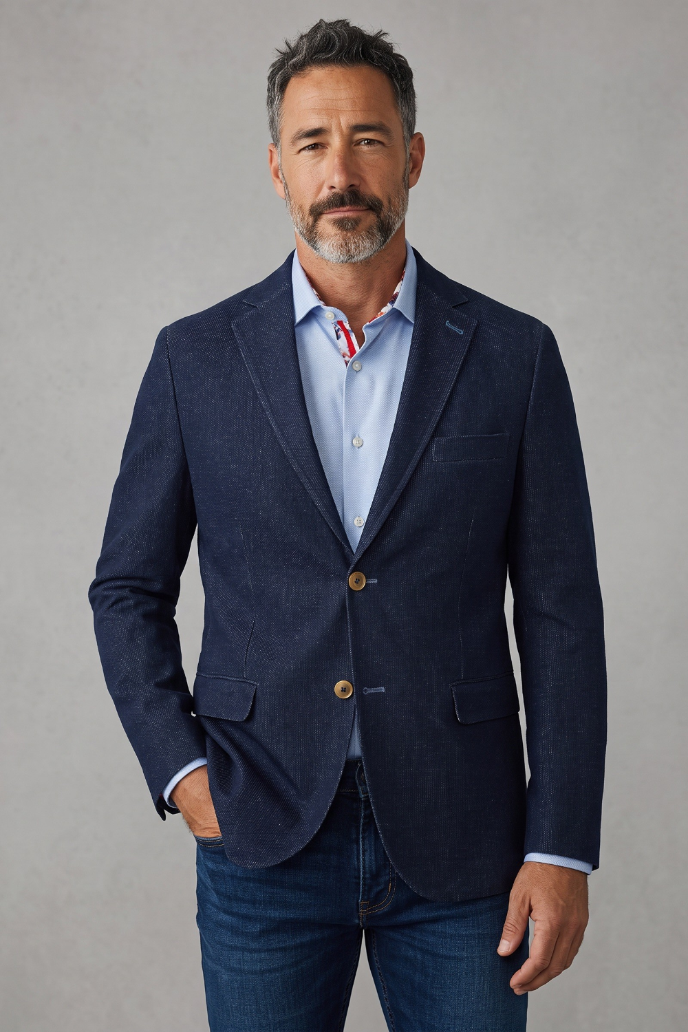 Broderick's Clothing Co. 7 Downie St. navy denim knit sport coat worn by a man with a light blue shirt