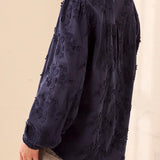 Broderick's Clothing Co. navy blue long sleeve blouse with tonal floral embroidery and a mandarin collar.