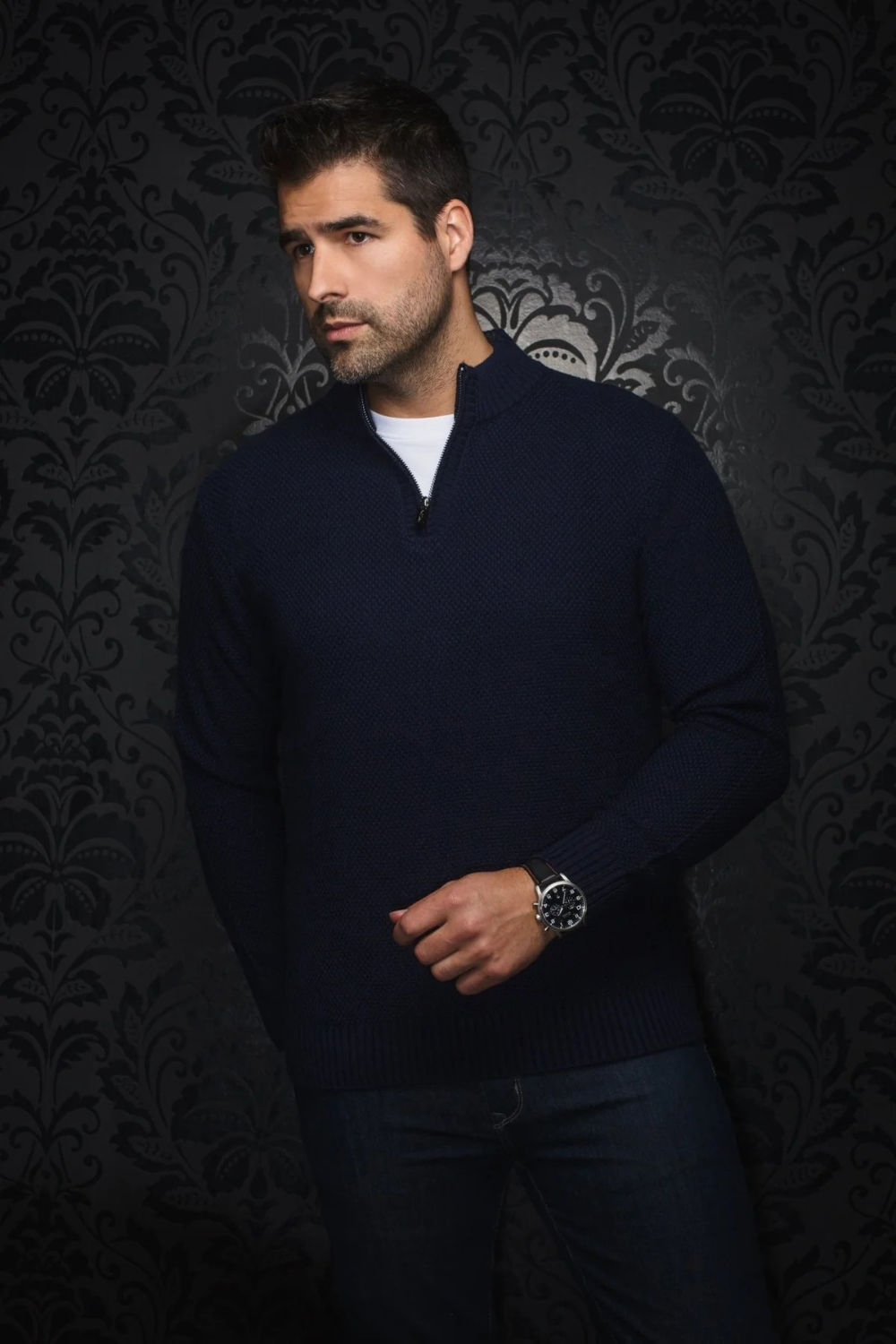 Broderick's Clothing Co. navy blue merino wool blend quarter zip sweater with rib-knit cuffs on a male model