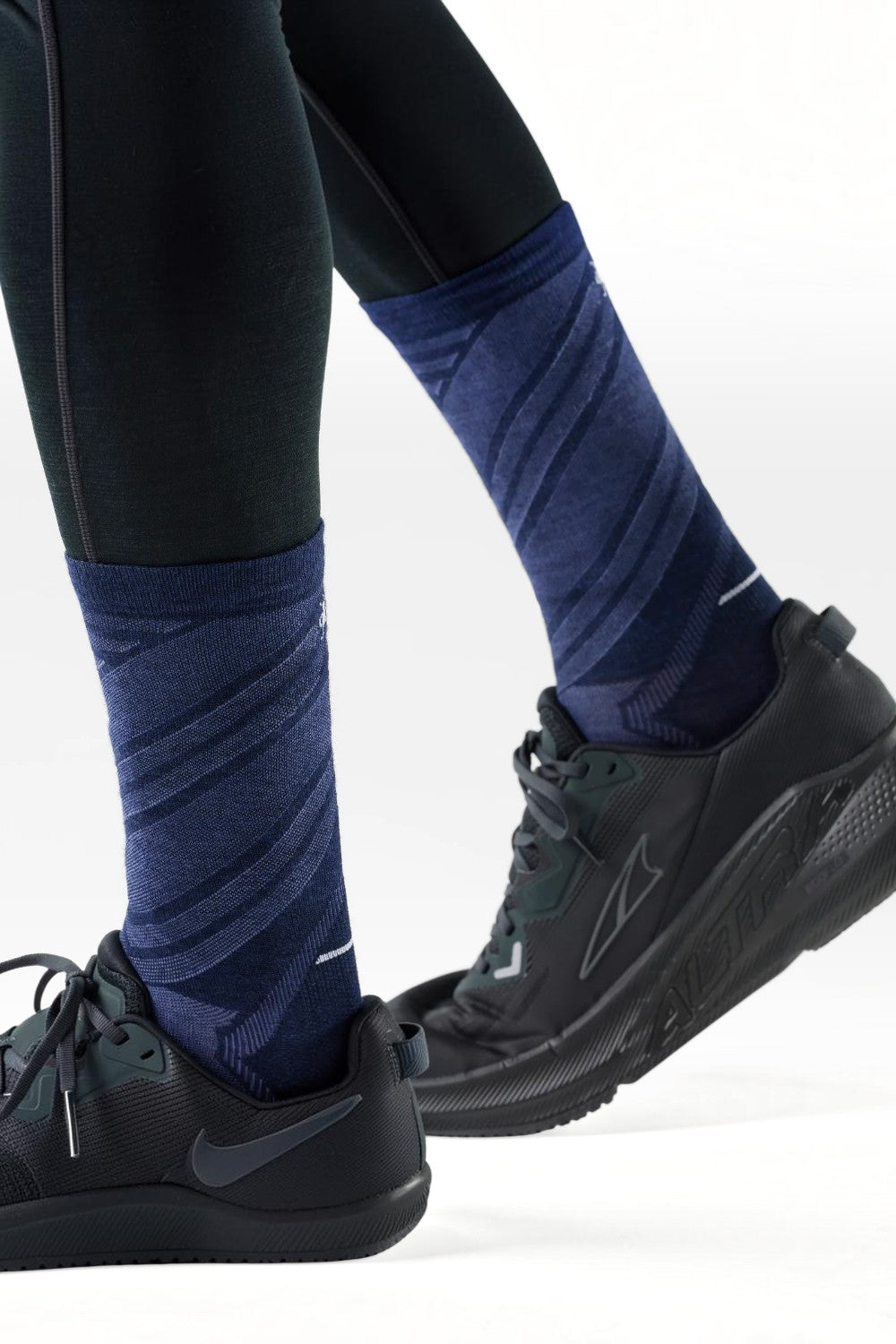 Broderick's Clothing Co. Smartwool men's navy blue crew running socks with diagonal pattern worn with black sneakers