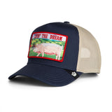 Broderick's Clothing Co. Goorin Bros. navy and beige trucker hat featuring a Livin' The Dream pig patch