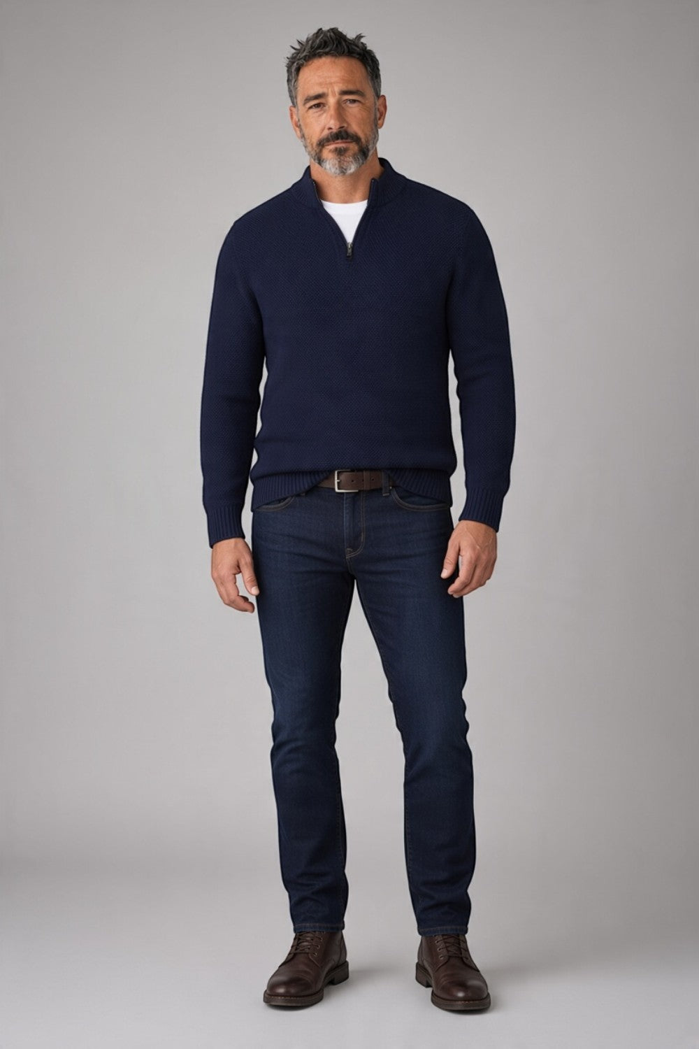 Broderick's Clothing Co. navy blue merino wool blend quarter zip sweater worn by a model with dark jeans and boots