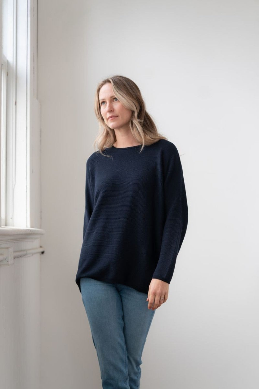 Broderick's Clothing Co. Echo Verde Sara crew neck sweater in dark navy with horizontal ribbing and dropped sleeves.
