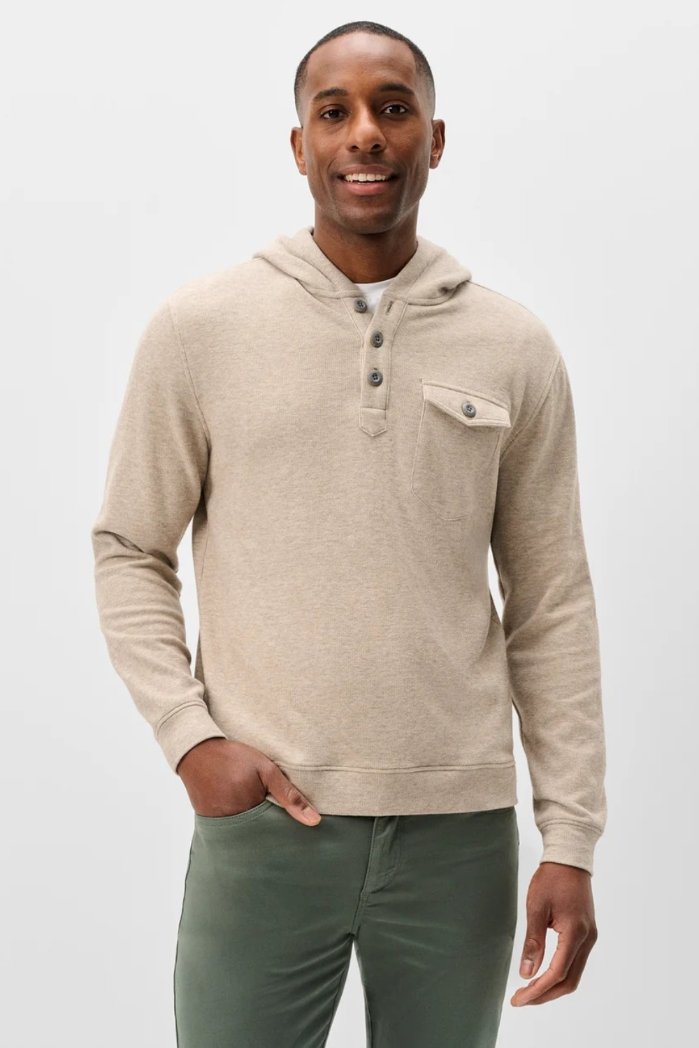 Broderick's Clothing Co. oatmeal heathered button henley hoodie with a chest pocket worn by a smiling man.