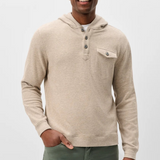 Broderick's Clothing Co. oatmeal heathered button henley hoodie with a chest pocket worn by a smiling man.