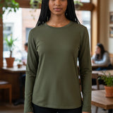 Model wearing a Broderick's Clothing Co. Shannon Passero Zoya olive green long sleeve top with a soft stretch fit.