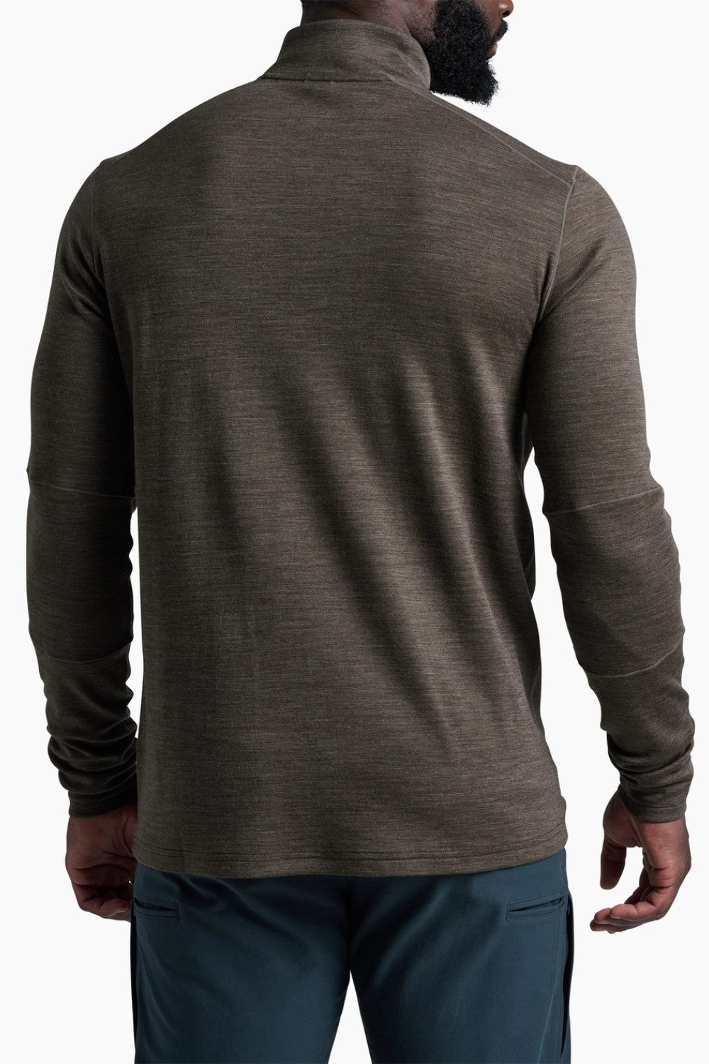 Back view of a man wearing a Broderick's Clothing Co. KÜHL INVIGORATR olive green merino wool 1/4 zip pullover