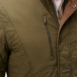 Broderick's Clothing Co. olive green diamond-quilted snap jacket with performance suede trim and zip chest pocket.