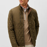 Broderick's Clothing Co. olive green diamond-quilted snap jacket with performance suede details on a male model.