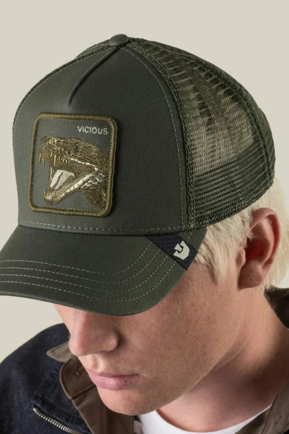 Broderick's Clothing Co. olive green Goorin Bros. trucker hat with a VICIOUS snake patch and breathable mesh back