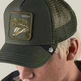 Broderick's Clothing Co. olive green Goorin Bros. trucker hat with a VICIOUS snake patch and breathable mesh back