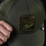 Broderick's Clothing Co. olive green Goorin Bros. trucker hat with a Vicious snake patch and breathable mesh back