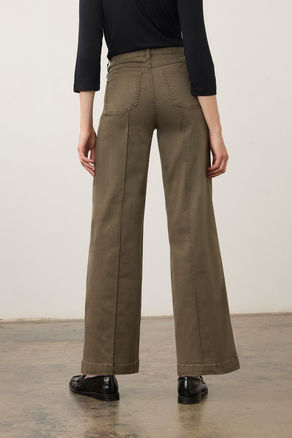 Back view of Broderick's Clothing Co. FDJ Olivia wide leg pants in olive green euro twill with pintuck detailing.