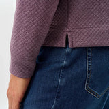 Broderick's Clothing Co. purple moratronic diamond knit henley pullover with side vent detail worn with blue jeans