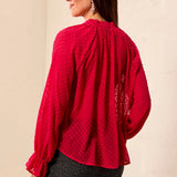 Broderick's Clothing Co. red sheer crinkle chiffon blouse with polka dot texture, long sleeves, and ruffled cuffs.