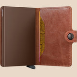 Broderick's Clothing Co. Secrid Miniwallet in vintage cognac-brown leather with an integrated aluminium card protector.