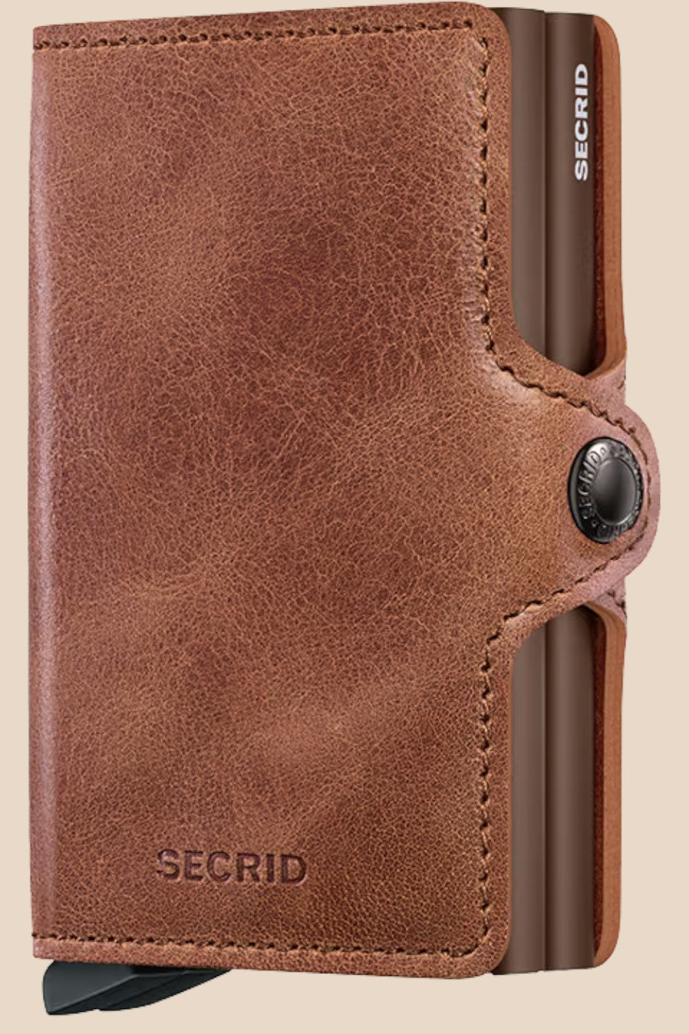 Broderick's Clothing Co. Secrid Twinwallet in vintage cognac-brown leather with a secure snap button closure.