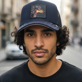 Broderick's Clothing Co. Goorin Bros. SHADOW REMIX navy trucker hat with a dachshund patch worn by a young man.