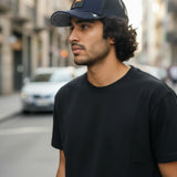Broderick's Clothing Co. Goorin Bros. SHADOW REMIX navy blue trucker hat with animal patch worn by a man outdoors
