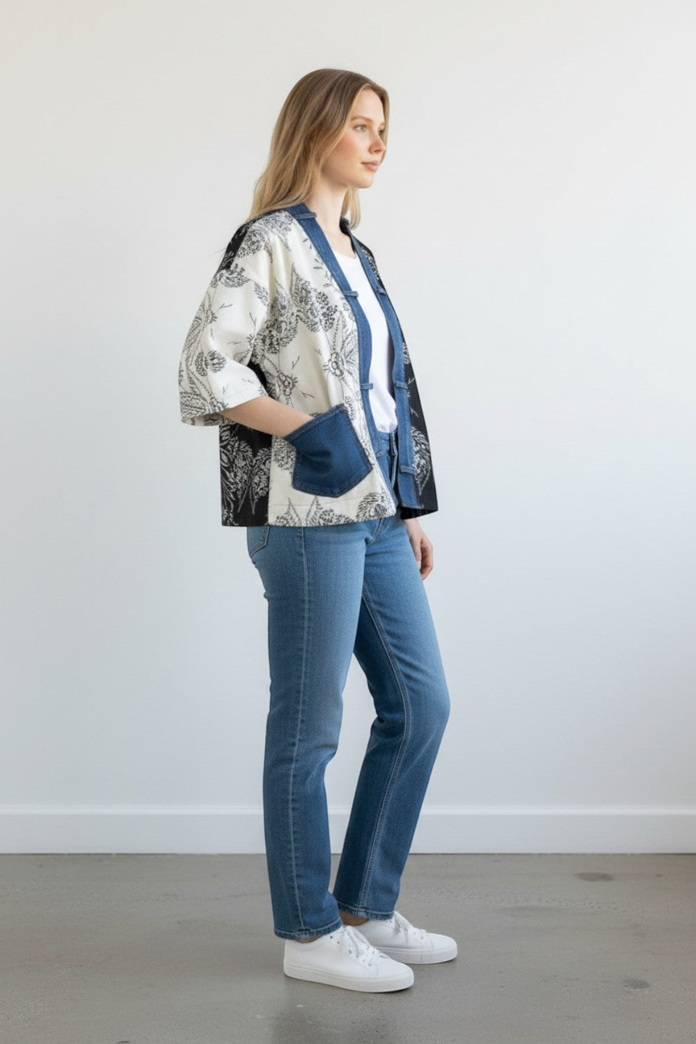 Broderick's Clothing Co. Shannon Passero Karol cardigan with split-panel floral print and denim trim on a model