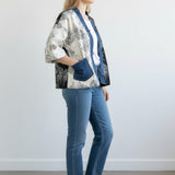 Broderick's Clothing Co. Shannon Passero Karol cardigan with split-panel floral print and denim trim on a model