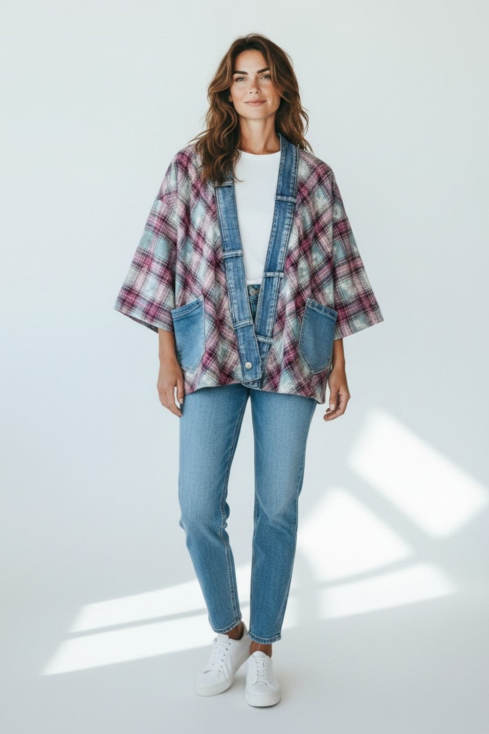 Model wearing a Broderick's Clothing Co. Shannon Passero Ruthie plaid cardigan with denim trim and patch pockets.